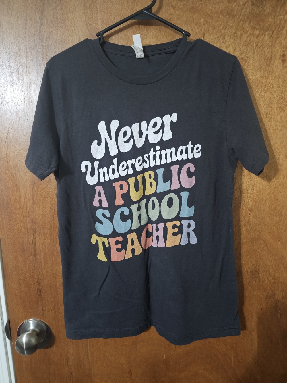 Bella Canvas Black Tee with Multi-Color Retro Teacher Text